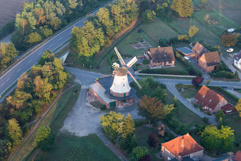 Historic windmill on a farm homestead on the edge of cultivated fields in Artlenburg in the state Lower Saxony, Germany