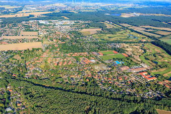 View of the town from the east with Walter-Maack ice stadium, outdoor swimming pool, sports fields and sports hall of the school center and TSV Adendorf v. 1923 eV in Adendorf in the state Lower Saxony, Germany