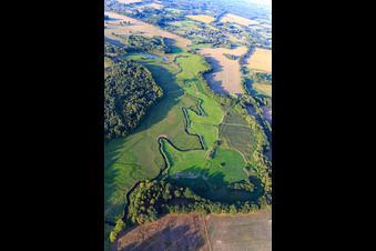 Aerial view of The Schaale stream meanders between meadows in the district Bretzin in Bengerstorf in the state Mecklenburg-Western Pomerania, Germany