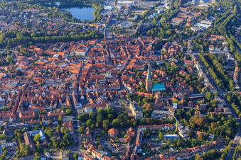 Overview of the old town area and city centre from the south in the evening with Große Bäckerstraße from St. Johannis Lüneburg to St. Nicolai in Lüneburg in the state Lower Saxony, Germany