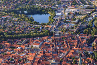 Overview of the old town area from the south in the evening with St. Nicolai and Kreidebergsee in Lüneburg in the state Lower Saxony, Germany