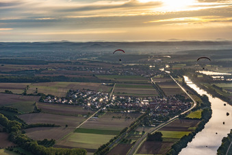 Aerial view of Two paragliders at sunrise over the Main in the district Untertheres in Theres in the state Bavaria, Germany