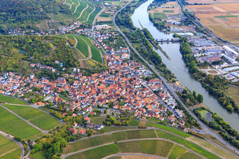 Wine-growing village between vineyards on the banks of the Main from the northeast in Randersacker in the state Bavaria, Germany