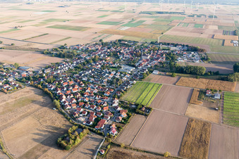 Village view on the edge of agricultural fields and land in Knittelsheim in the state Rhineland-Palatinate, Germany