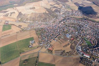 Village view on the edge of agricultural fields and land in Rimpar in the state Bavaria, Germany