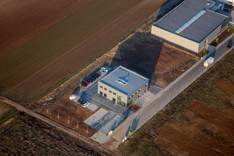 Aerial view of New building construction site in the industrial park Gewerbepark West with M-Systems IT Solutions in Herxheim bei Landau (Pfalz) in the state Rhineland-Palatinate, Germany