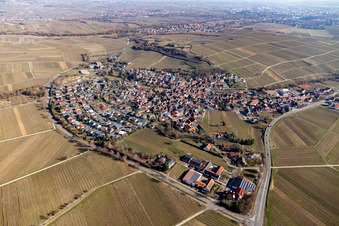 Agricultural land and field borders surround the settlement area of the village in Ilbesheim bei Landau in der Pfalz in the state Rhineland-Palatinate, Germany