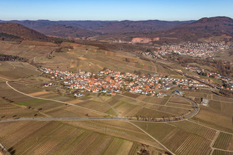 View of a winegrowing village from the south in winter without snow in Birkweiler in the state Rhineland-Palatinate, Germany