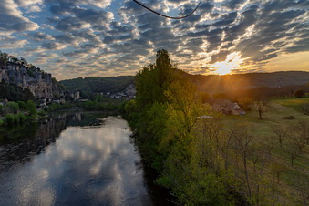 Chateau de la Malartrie at sunrise over the Dordogne in La Roque-Gageac in the state Dordogne, France