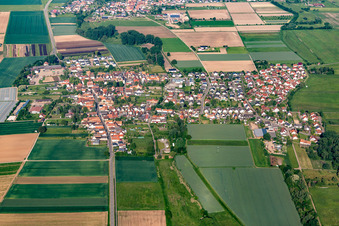 Aerial view of Village view on the edge of agricultural fields and land in Knittelsheim in the state Rhineland-Palatinate, Germany