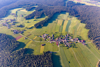 Aerial view of Surrounded by forest and forest areas center of the streets and houses and residential areas in Aichelberg in the state Baden-Wurttemberg, Germany