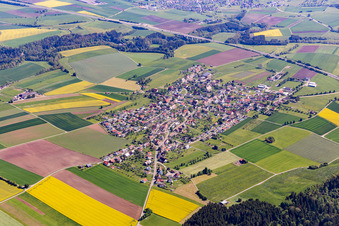 Agricultural land and field borders surround the settlement area of the village in Irslingen in the state Baden-Wurttemberg, Germany