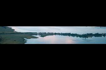Bridge to the Island Reichenau on the Lake of Constance during sunset in Reichenau in the state Baden-Wurttemberg