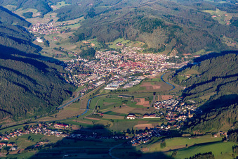 Location view of the streets and houses of residential areas in the valley landscape surrounded by mountains of the black forest in Haslach im Kinzigtal in the state Baden-Wurttemberg, Germany