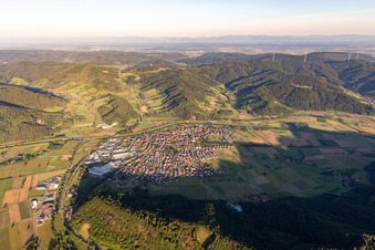 Location view of the streets and houses of residential areas in the valley landscape surrounded by mountains of the Black Forest in Biberach in the state Baden-Wurttemberg, Germany