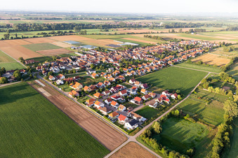 Aerial view of Agricultural land and field borders surround the settlement area of the village in Boebingen in the state Rhineland-Palatinate, Germany