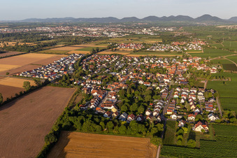 Agricultural land and field borders surround the settlement area of the village in Bornheim in the state Rhineland-Palatinate, Germany