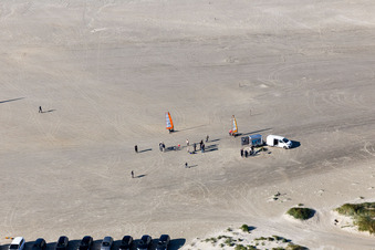 Buggies and kite surfers on the sandy beach in Fanø in the state South Denmark, Denmark out of the air