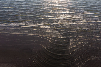Beach landscape along the with waves in Fanoe in Region Syddanmark, Denmark