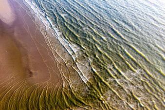 Aerial view of Beach landscape along the with waves in Fanoe in Region Syddanmark, Denmark