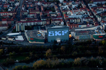 Building of the shopping center Stadtgalerie Schweinfurt and illumated SKF Hochhaus at dawn in Schweinfurt in the state Bavaria, Germany