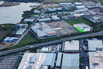 XXXL-sized chair on the parkinkg of the furniture market XXXLutz Neubert Schweinfurt in Gewebegebiet Maintal at dusk in Schweinfurt in the state Bavaria, Germany