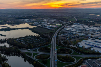 Sunset traffic flow at the intersection- motorway A 7 Exit Centre in Schweinfurt in the state Bavaria, Germany