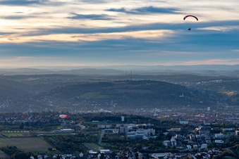 Zeppelin and paraglider over Galgenberg in Gerbrunn in the state Bavaria, Germany