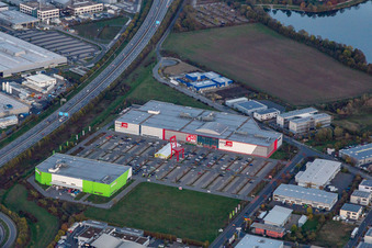 Aerial view of XXXL-sized chair on the parkinkg of the furniture market XXXLutz Neubert Schweinfurt in Gewebegebiet Maintal in Schweinfurt in the state Bavaria, Germany