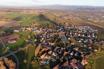 Village view on the edge of agricultural fields and land and sporting fields in the district Buehl in Offenburg in the state Baden-Wurttemberg, Germany