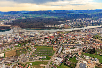 B34 along the Rhine with the transformer station of naturenergie netze GmbH / site Rheinfelden and hydroelectric power plant Rheinfelden and industrial area with Evonik and RheinPerChemie GmbH in Rheinfelden in the state Baden-Wuerttemberg, Germany