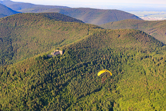 Paraglider in front of Neuscharfeneck Castle in Flemlingen in the state Rhineland-Palatinate, Germany