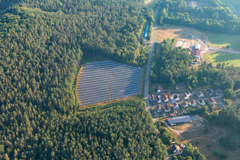 Aerial view of Petersbächel PV system in forest clearing in Fischbach bei Dahn in the state Rhineland-Palatinate, Germany