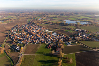 Drone recording of Agricultural land and field borders surround the settlement area of the village in Hardtwald in the state Rhineland-Palatinate, Germany