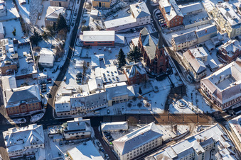 Wintry snowy church building of St. Martin at Ludwigsplatz in Bad Bergzabern in the state Rhineland-Palatinate, Germany