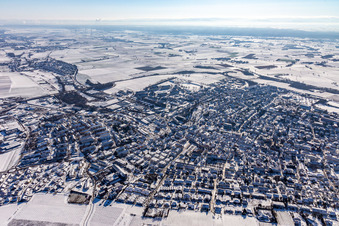 Aerial photograpy of Wintry snowy townscape with streets and houses of the residential areas in Bad Bergzabern in the state Rhineland-Palatinate