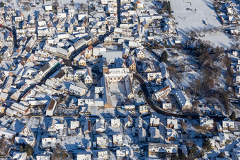 Aerial view of Winter aerial view in the snow of the monastery Klingenmünster in Klingenmünster in the state Rhineland-Palatinate, Germany