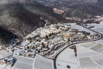 Wintry snowy hospital grounds of the Clinic Klinik fuer Kinder-/Jugendpsychiatrie and -psychotherapie in the district Pfalzklinik Landeck in Klingenmuenster in the state Rhineland-Palatinate, Germany