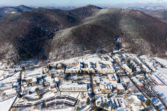 Aerial photograpy of Wintry snowy hospital grounds of the Clinic Klinik fuer Kinder-/Jugendpsychiatrie and -psychotherapie in the district Pfalzklinik Landeck in Klingenmuenster in the state Rhineland-Palatinate, Germany