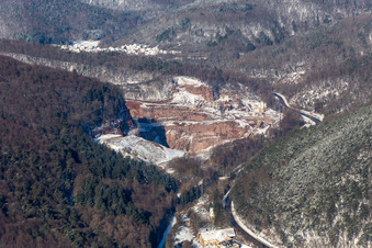 Winter aerial view in the snow of the PfalzGranit quarry in Waldhambach in the state Rhineland-Palatinate, Germany
