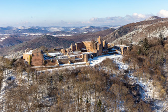 Aerial view of Wintry snowy ruins and vestiges of the former castle and fortress Burgruine Madenburg in Eschbach in the state Rhineland-Palatinate