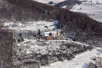 Winter aerial view in the snow from Slevogthof in Leinsweiler in the state Rhineland-Palatinate, Germany