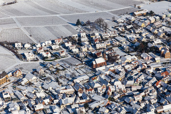 Winter aerial view of the Protestant church in the snow in Birkweiler in the state Rhineland-Palatinate, Germany