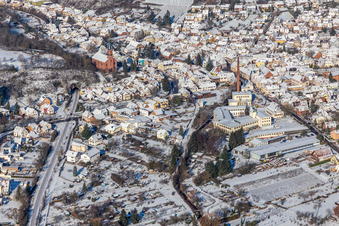 Winter aerial view in the snow of GET Metall and church in Albersweiler in the state Rhineland-Palatinate, Germany
