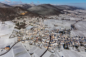 Aerial view of Wintry snowy Village - view on the edge of wine yards in Frankweiler in the state Rhineland-Palatinate, Germany