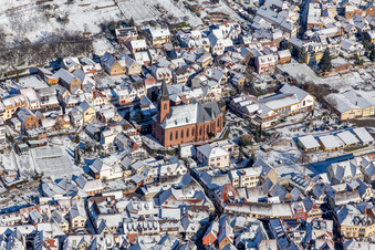 Wintry snowy church of St. Martin in Sankt Martin in the state Rhineland-Palatinate, Germany