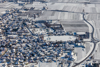 Winter aerial photograph in the snow of the sports field of TUS Maikammer 1920 eV in Maikammer in the state Rhineland-Palatinate, Germany