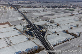 Winter aerial photograph in the snow of the Pfälzer Weinstraße motorway service station in Edesheim in the state Rhineland-Palatinate, Germany