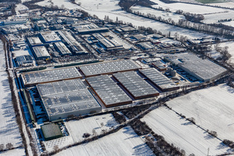 Wintry snowy industrial and commercial area Landau Ost with Michelin Tires and APL Automobil-Prueftechnik Landau GmbH in Landau in der Pfalz in the state Rhineland-Palatinate, Germany