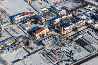 Aerial view of Wintry snowy buildings of the Childrens and Youth Home Jugendwerk St. Josef in the district Queichheim in Landau in der Pfalz in the state Rhineland-Palatinate, Germany